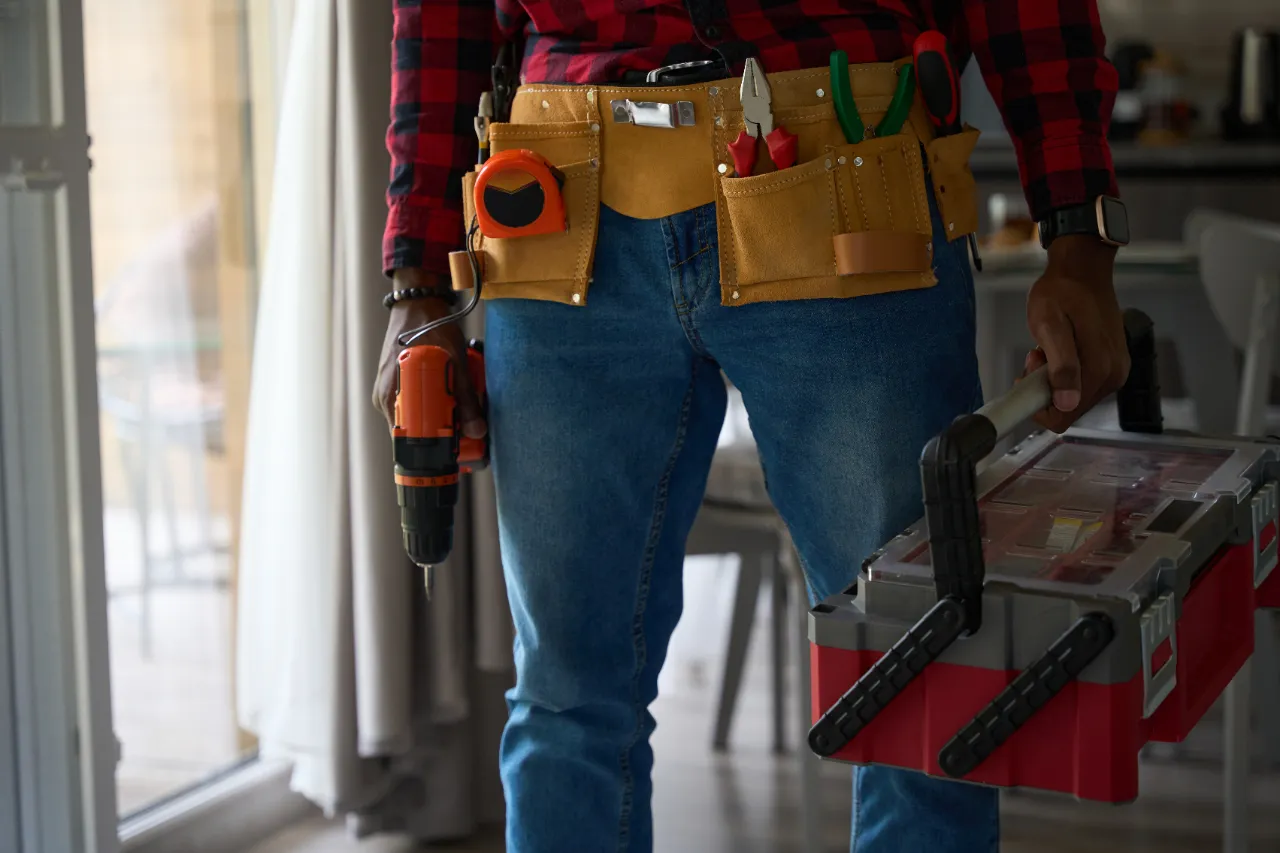 Handyman arriving for recurring repairs in a New York apartment building